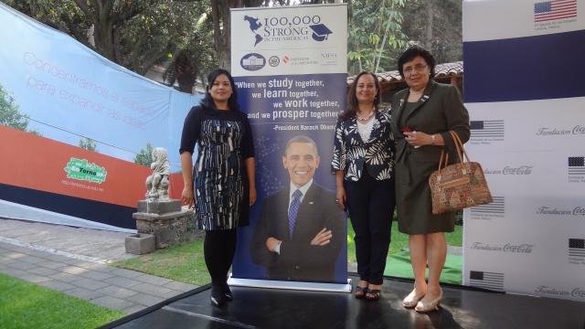 Group posing in front of banner